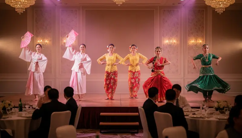 Cultural dance in Singapore with Chinese fan dancers, Malay dancers in kebaya and an Indian classical dancer on a hotel ballroom stage